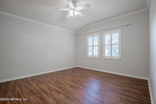 unfurnished room featuring ornamental molding, vaulted ceiling, and dark wood-type flooring