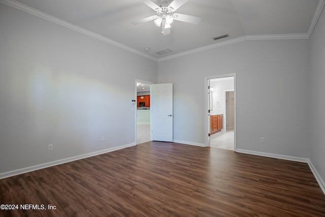 unfurnished room featuring crown molding, vaulted ceiling, dark hardwood / wood-style floors, and ceiling fan