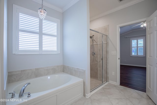 bathroom featuring tile patterned flooring, crown molding, separate shower and tub, and a chandelier