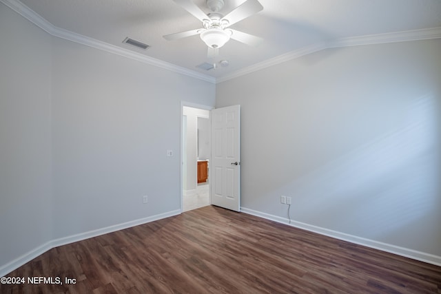 spare room with ornamental molding, ceiling fan, and dark hardwood / wood-style flooring