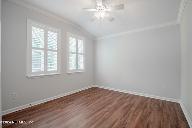 spare room featuring dark hardwood / wood-style flooring, crown molding, vaulted ceiling, and ceiling fan