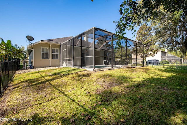 back of house featuring a yard