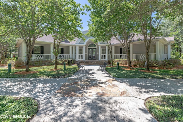 ranch-style home featuring french doors