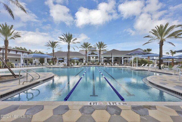 view of swimming pool with a patio area