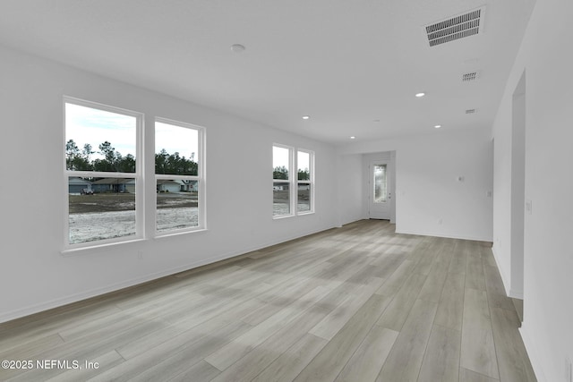 unfurnished room featuring light hardwood / wood-style flooring