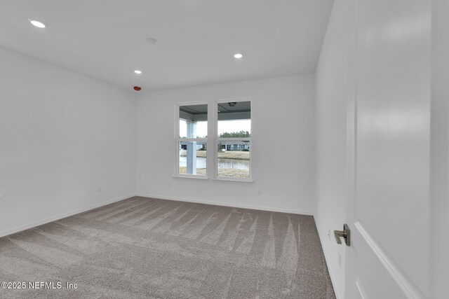 unfurnished room with carpet