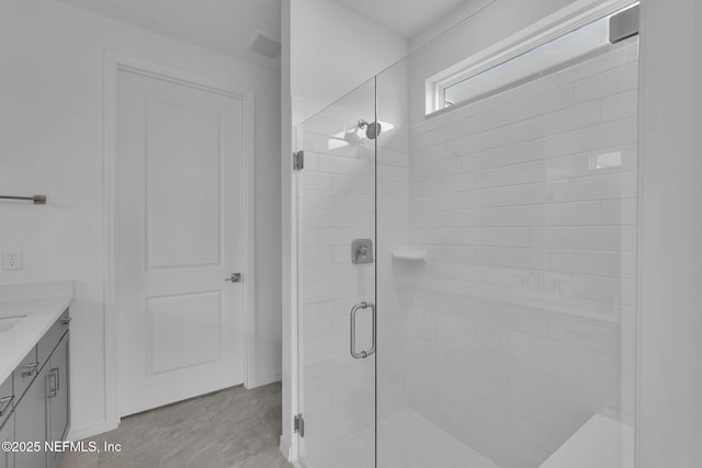 bathroom with vanity and walk in shower