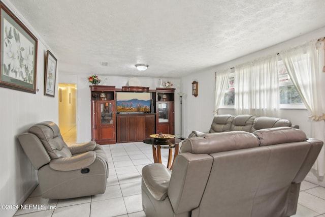 tiled living room with a textured ceiling