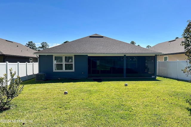 back of house with a yard, central AC unit, and a sunroom