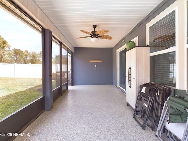 sunroom featuring a ceiling fan