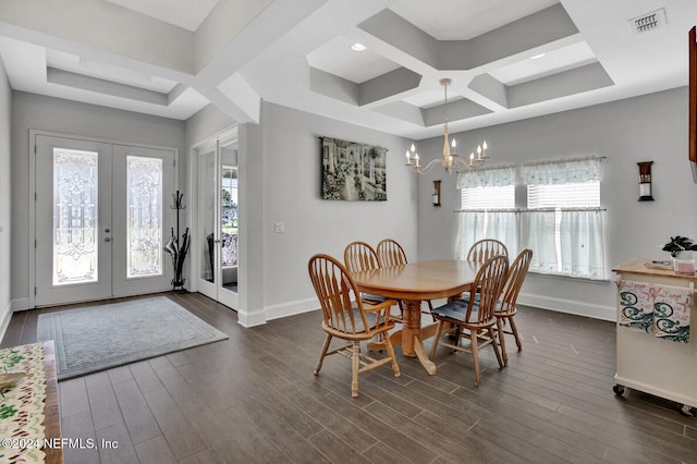 dining space with french doors, coffered ceiling, a chandelier, and dark hardwood / wood-style floors