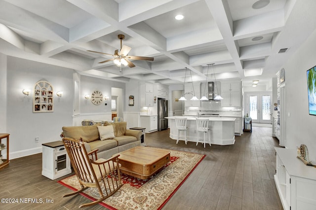 living room featuring french doors, coffered ceiling, beamed ceiling, and dark hardwood / wood-style flooring