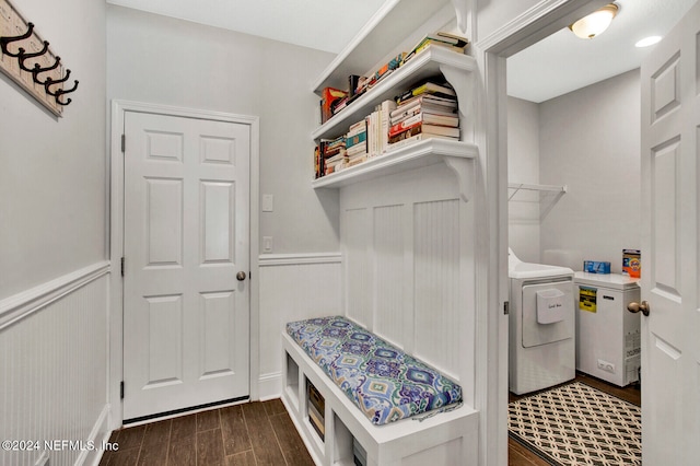 mudroom with dark wood-type flooring and separate washer and dryer