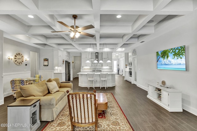 living room featuring coffered ceiling, beamed ceiling, and dark hardwood / wood-style flooring