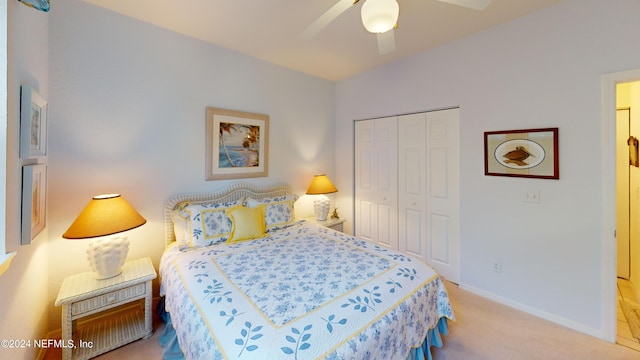 bedroom with a closet, baseboards, carpet, and a ceiling fan