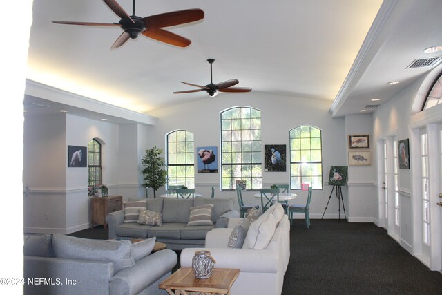 living room featuring vaulted ceiling, baseboards, visible vents, and dark carpet