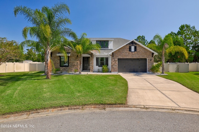 view of front facade featuring a garage and a front yard