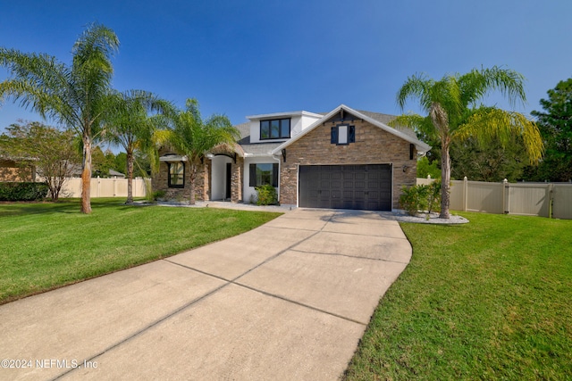 view of front facade featuring a garage and a front yard