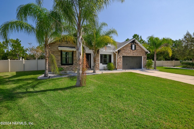 view of front facade with a garage and a front lawn