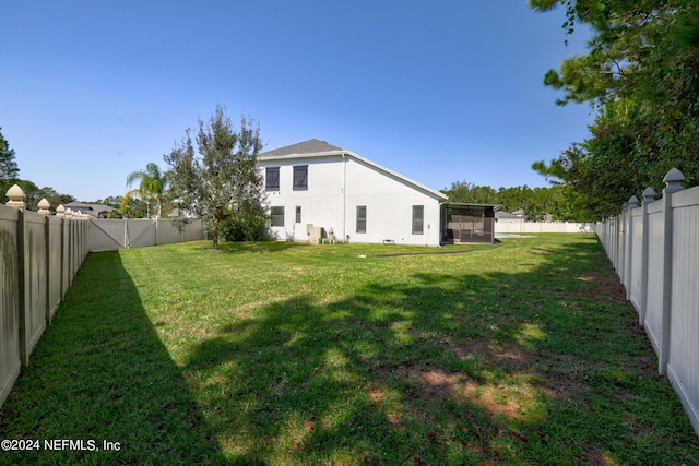 1309 Acorn Ridge Ct, Saint Augustine, FL 32092 - view of yard featuring a fenced backyard and a sunroom