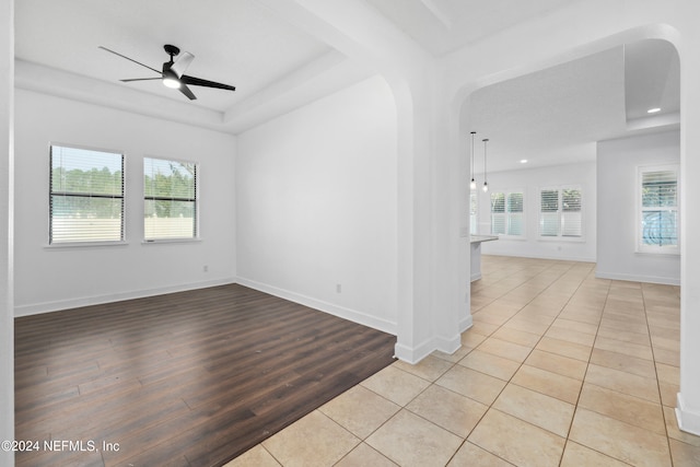 unfurnished room with ceiling fan and light hardwood / wood-style flooring