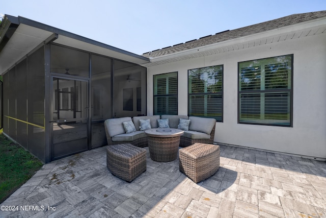 view of patio with an outdoor hangout area and a sunroom