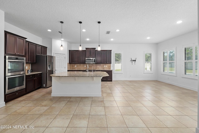 1309 Acorn Ridge Ct, Saint Augustine, FL 32092 - kitchen featuring backsplash, stainless steel appliances, recessed lighting, and a textured ceiling