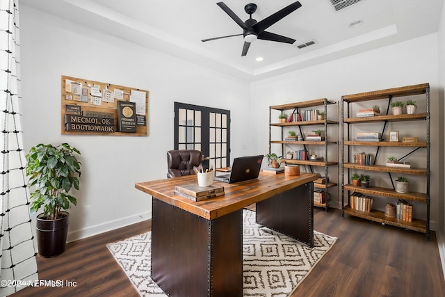 home office with french doors, ceiling fan, and dark wood-type flooring