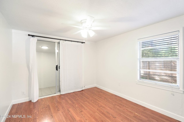 unfurnished bedroom featuring ceiling fan and wood-type flooring