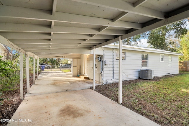 view of patio featuring central AC unit and a carport