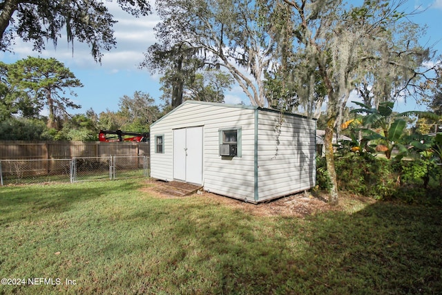 view of outbuilding with a yard