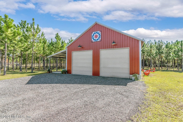 garage featuring a yard