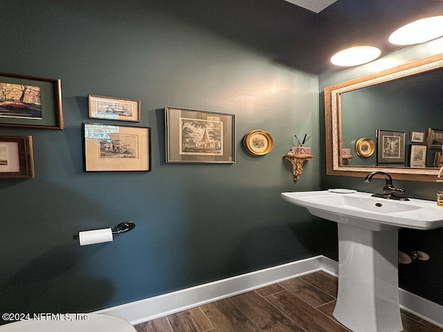 bathroom with wood-type flooring