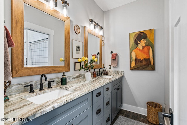 bathroom featuring vanity and hardwood / wood-style floors