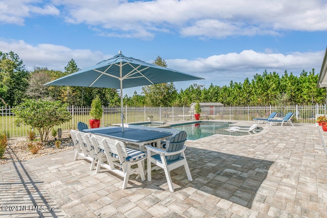 view of swimming pool featuring a patio area