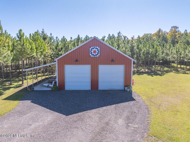 garage featuring a lawn