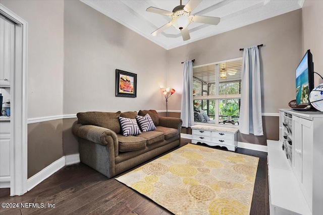 living room featuring crown molding, dark hardwood / wood-style floors, and ceiling fan