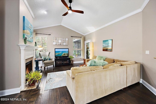 living room with a textured ceiling, hardwood / wood-style floors, ceiling fan, lofted ceiling, and ornamental molding