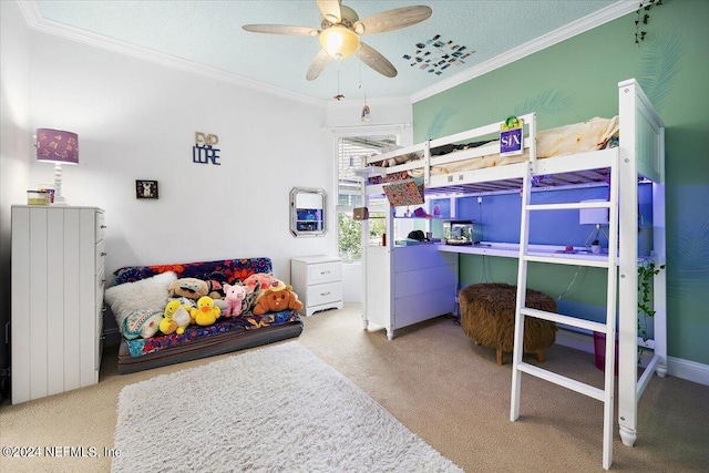 carpeted bedroom featuring crown molding and ceiling fan