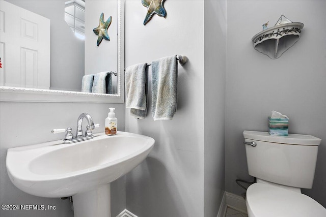 bathroom with toilet and sink