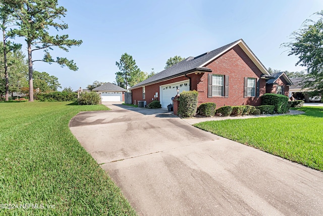 view of front facade featuring cooling unit, a front lawn, and a garage