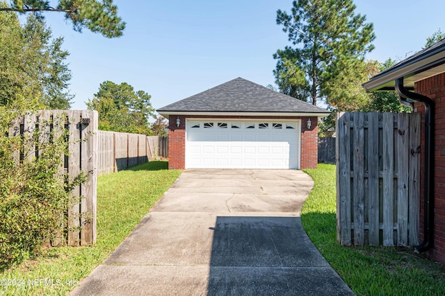 garage featuring a yard