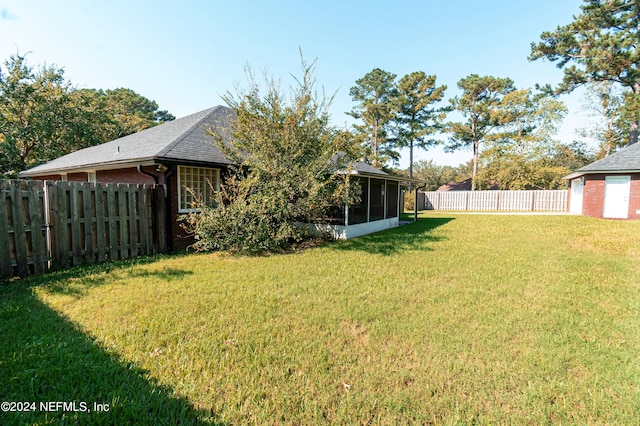 view of yard with a sunroom