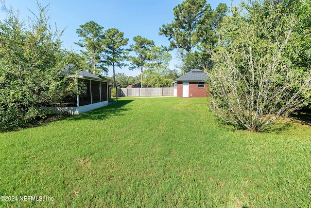 view of yard with a sunroom