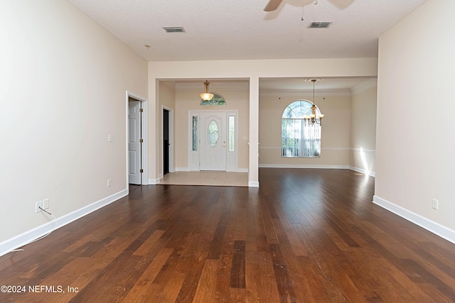 entrance foyer with a textured ceiling, wood-type flooring, and ceiling fan with notable chandelier