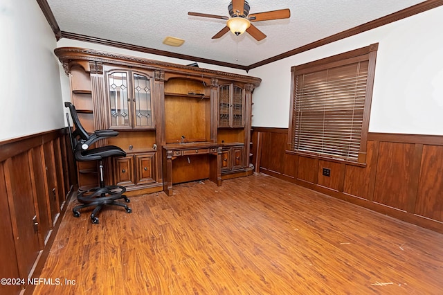 office area featuring crown molding, wood-type flooring, and a textured ceiling