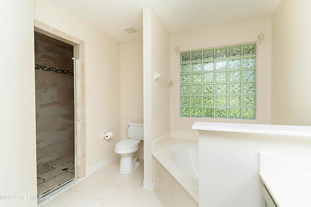 full bathroom featuring tile patterned floors, plus walk in shower, toilet, vanity, and a textured ceiling