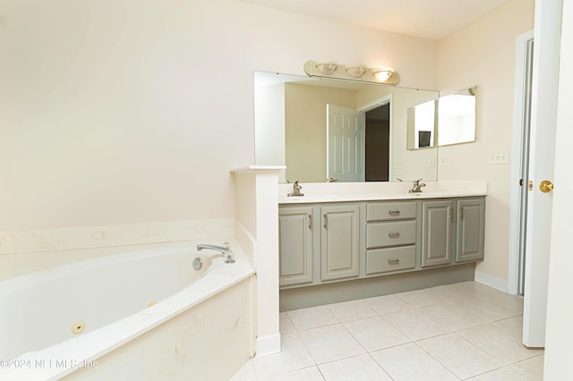 bathroom featuring vanity, a tub, and tile patterned flooring