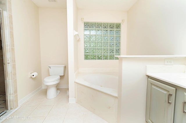 bathroom with vanity, toilet, tile patterned floors, and a bathtub