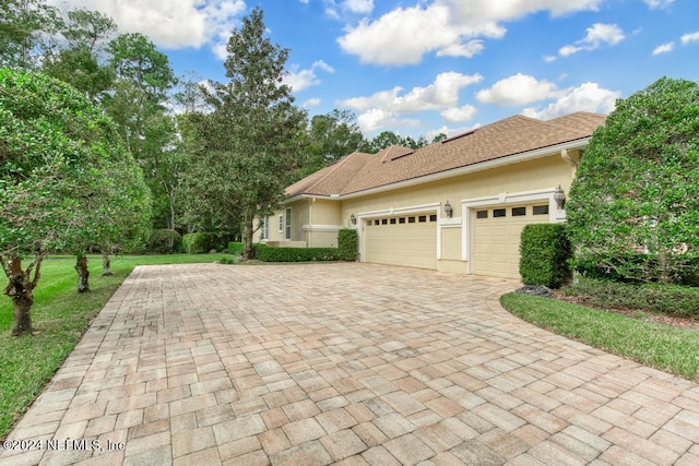 view of side of property with a garage